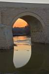 Puente Romano spans Rio Guadalquivir at sunset in city of Cordoba Province of Cordoba Andalusia