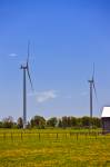 Stock photo of alternative energy, windmills or wind turbines stand in a field on the Bruce Peninsula, Ontario, Canada.