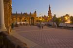 Stock photo of the tower, bridge and fountain seen from the central building at the Plaza de Espana, Parque Maria Luisa, during dusk in the City of Sevilla (Seville), Province of Sevilla, Andalusia (Andalucia), Spain, Europe.