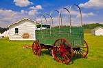 Stock photo of a green wagon outside the stables at Fort Walsh National Historic Site, Cypress Hills Interprovincial Park, Saskatchewan, Canada.