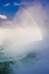 Stock photo of Horseshoe Falls with a rainbow in the misty air above the Niagara River in Niagara Falls, Ontario, Canada.