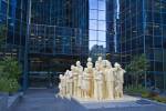 Stock photo of The Illuminated Crowd by artist Raymond Mason at the entrance to the BNP Tower - Laurentian Bank Tower in downtown Montreal, Quebec, Canada.