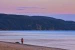 Stock Photo of people on the beach in Agawa Bay during sunset in Lake Superior Provincial Park, Ontario, Canada.