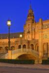 Stock photo of the central building and bridge at Plaza de Espana, Parque Maria Luisa, during dusk in the City of Sevilla (Seville), Province of Sevilla, Andalusia (Andalucia), Spain, Europe.
