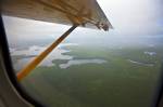 Stock photo aerial view of lakes, islands, and forests in northern Ontario, Canada. This picture was captured during a flight in a De Havilland DHC-3 Otter aircraft from above Red Lake.