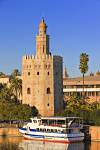 Stock photo of Torre del Oro (Tower of Gold) which also houses the Museo Maritimo (Naval Museum) on the banks of Rio Guadalquivir River, El Arenal District, City of Sevilla, Province of Sevilla, Andalusia, Spain, Europe.