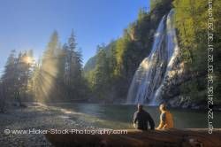 Sun rays and couple Virgin Falls Tofino Creek Vancouver Island British Columbia Canada