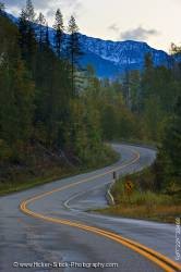 Winding road snowcapped mountain peaks Kootenay Canada
