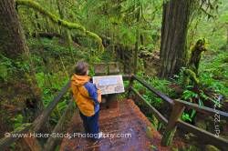 Woman and Sign Rainforest Trail Pacific Rim National Park Vancouver Island British Columbia Canada