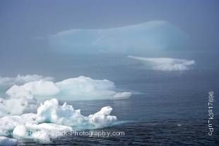 Stock photo of an iceberg in the Strait of Belle Isle seen from Sandy Cove during a foggy day along Highway 430, Trails to the Vikings, Viking Trail, Great Northern Peninsula, Northern Peninsula, Newfoundland, Canada.