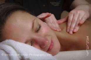 Stock photo of a young woman enjoying a relaxing back and shoulder massage at the Black Bear Resort & Spa in Port McNeill, Northern Vancouver Island, Vancouver Island, British Columbia, Canada.