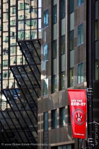 Stock photo of Red flag raptors basketball team glass facades buildings Toronto
