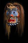 Stock photo of a work of art, a wooden Bakwas mask by Don Svanvik, Kwakwaka'wakw First Nations artist, original West Coast native art, on display at Just Art Gallery, Port McNeill, Northern Vancouver Island, British Columbia, Canada.  