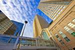 Stock photo of the Twin Towers of the Bankers Hall and a bridge which is part of the Plus 15 Walkway system connecting high-rise buildings and shopping centres in the city of Calgary, Alberta, Canada. Looking up from the street level you see a very tall p