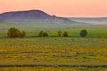 Stock photo of the large, open farmland in the Big Muddy Badlands at sunset, Southern Saskatchewan, Canada.