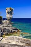 Stock photo of the Sea Stack along the shoreline of Flowerpot Island in the Fathom Five National Marine Park, Lake Huron, Ontario, Canada. Model Released.