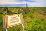 Stock photo of an interpretive sign at the East Gate of the Spirit Sands Trail, Spruce Woods Provincial Park, Manitoba, Canada.