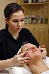 Stock photo of a woman receiving a facial massage at the Black Bear Resort & Spa, Port McNeill, Northern Vancouver Island, Vancouver Island, British Columbia, Canada