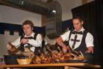 Stock photo of men carving the roast geese during a medieval feast at Schloss Auerbach (Auerbach Castle), Bensheim-Auerbach, Hessen, Germany, Europe.