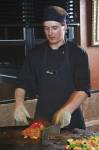 Stock photo of chef preparing meals at the Mongolie Grill World Famous Stirfry Restaurant in Whistler Village, British Columbia, Canada. 