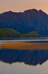 Stock photo of the mountain reflections on the Clayoquot Arm of Kennedy Lake, a transition area of the Clayoquot Sound UNESCO Biosphere Reserve, Vancouver Island, British Columbia, Canada.
