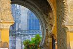 Stock photo of looking through the archway of Puerta del Perdon (Door of Forgiveness), Seville Cathedral and La Giralda (bell tower/minaret), a UNESCO World Heritage Site, Santa Cruz District, City of Sevilla (Seville), Province of Sevilla, Andalusia (And