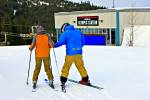 Stock photo of a Ski instructor with a student on Whistler Mountain, Whistler Blackcomb, Whistler, British Columbia, Canada.