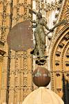 Stock photo of replica of the weather vane, a statue representing Faith outside the Door of the Prince (or San Cristobal), Seville Cathedral and La Giralda (bell tower/minaret), a UNESCO World Heritage Site, Santa Cruz District, City of Sevilla (Seville),