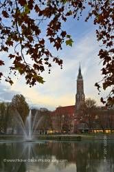 Bell tower of Martinskirche Isar River Fountain City Landshut Bavaria Germany