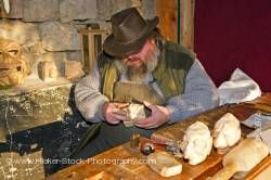 Man carving heads Christmas Markets at the Hexenagger Castle Hexenagger Bavaria Germany Europe