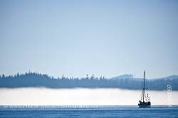 Sailboat in fog near Port Hardy Vancouver Island British Columbia Canada
