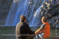 Couple Viewing The Virgin Falls Along Tofino Creek Vancouver Island British Columbia Canada