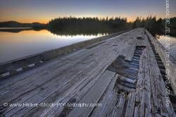 Wooden bridge sunset Clayoquot Arm of Kennedy Lake Vancouver Island British Columbia Canada