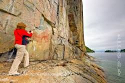 Woman on Rock Ledge along the Agawa Rock Pictographs Trail in Lake Superior Provincial Park Ontario