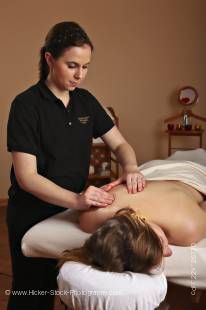 Stock photo of a masseuse providing a relaxing body massage for a woman at the Black Bear Resort & Spa in Port McNeill, Northern Vancouver Island, Vancouver Island, British Columbia, Canada.