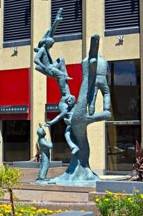 Stock photo of a bronze statue of children playing in a tree.  This statue is outside the Richardson Building in Winnipeg, Manitoba.