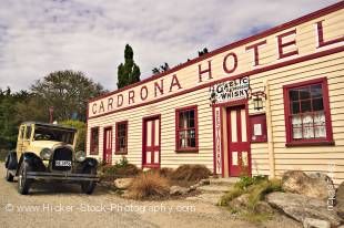 Stock photo of the historic Cardrona Hotel (est. 1863) with an old vintage Chrysler car parked outside, Crown Range Road, Central Otago, South Island, New Zealand