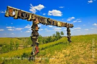Stock photo of cowboy boots hanging up on a frame at the entrance to The Great Sand Hills near Sceptre, Saskatchewan, Canada.