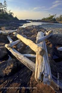 Stock photo of driftwood strewn over a rocky outcrop along South Beach, Pacific Rim National Park, Long Beach Unit, Clayoquot Sound UNESCO Biosphere Reserve, West Coast, Pacific Ocean, Vancouver Island, British Columbia, Canada.