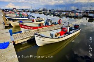 Stock photo of endless fishing boats the Main Dock Boat Harbour on the shores of Lake Winnipeg in the town of Gimli, Manitoba, Canada.