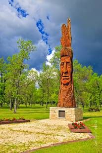 Stock photo of Cedar carving of an Indian head named Whispering Giant (which honours the Ojibwa, Cree, and Assiniboine First Nations) in Winnipeg Beach Provincial Recreation Area, in the town of Winnipeg Beach, Manitoba, Canada.