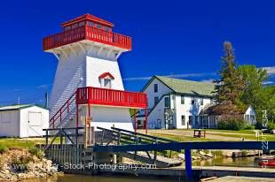 Stock photo of a red and white lighthouse at the marina in Gull Harbour, Lake Winnipeg, Hecla Provincial Park, Hecla Island, Manitoba, Canada.
