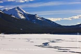 Stock photo of frozen channels through the ice and snow on Medicine Lake, along Maligne Lake Road in Jasper National Park in the Canadian Rocky Mountains, Alberta, Canada.