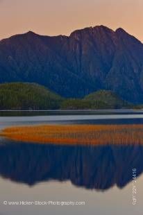 Stock photo of the mountain reflections on the Clayoquot Arm of Kennedy Lake, a transition area of the Clayoquot Sound UNESCO Biosphere Reserve, Vancouver Island, British Columbia, Canada.