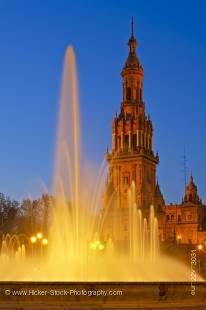 Stock photo of the tower and fountain at the Plaza de Espana, Parque Maria Luisa, during dusk in the City of Sevilla (Seville), Province of Sevilla, Andalusia (Andalucia), Spain, Europe.