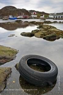Stock photo of a car tire in the harbour in the town of Great Brehat along Highway 430-76, Viking Trail, Trails to the Vikings, Great Northern Peninsula, Northern Peninsula, Newfoundland, Canada.