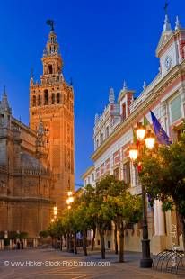 Stock photo of the Seville Cathedral and La Giralda (bell tower/minaret), a UNESCO World Heritage Site, seen from Plaza del Triunfo at Dusk, Santa Cruz District, City of Sevilla (Seville), Province of Sevilla, Andalusia (Andalucia), Spain, Europe.