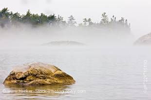 Stock photo of fog shrouded Sinclair Cove in Lake Superior Provincial Park, Ontario Canada. The protected shores and waters of Sinclair Cove in the pristine Lake Superior Provincial Park of Canada, are a hidden gem.