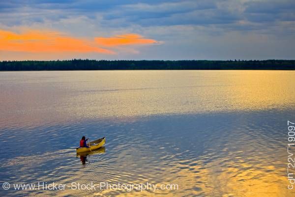 Stock photo of Canoe ride sunset Lake Audy Riding Mountain National Park Manitoba Canada