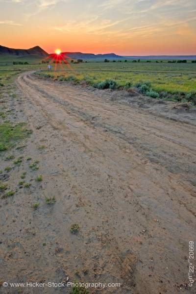 Stock photo of Farmland dirt road sunset Big Muddy Badlands Southern Saskatchewan Canada